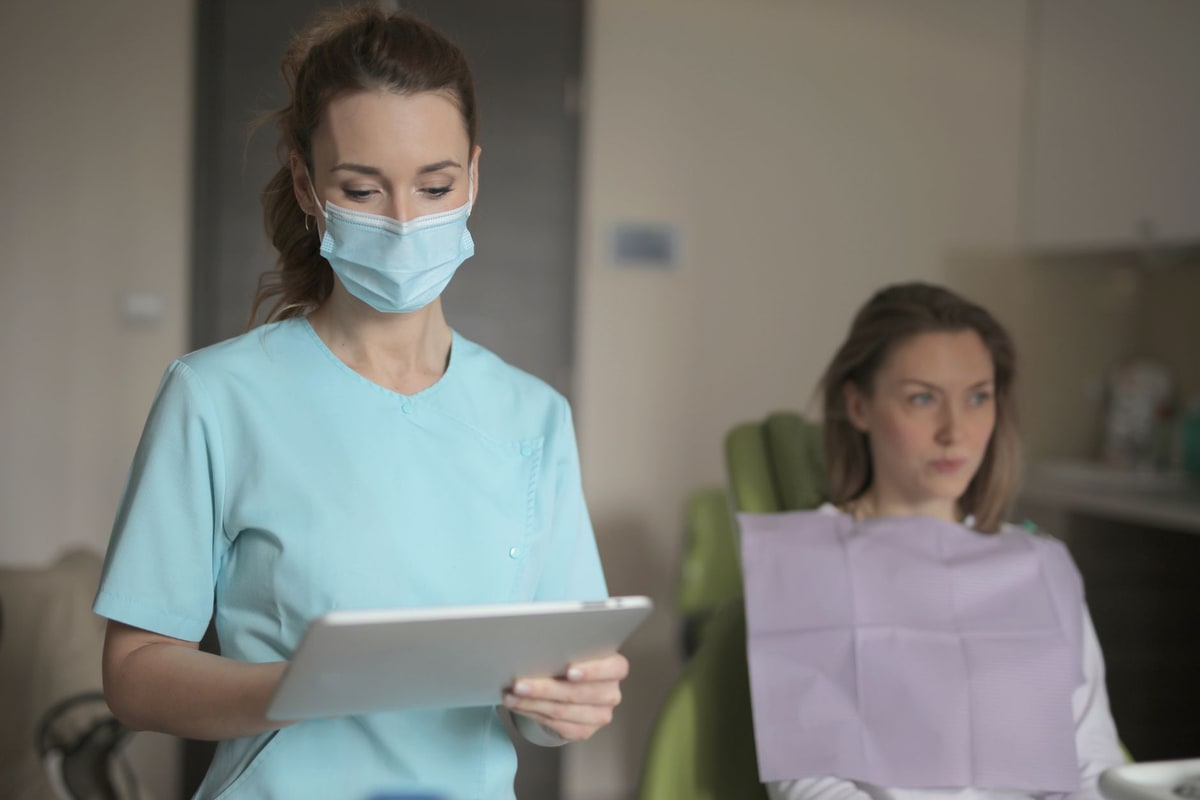 Dentist consulting with a patient in a modern treatment room