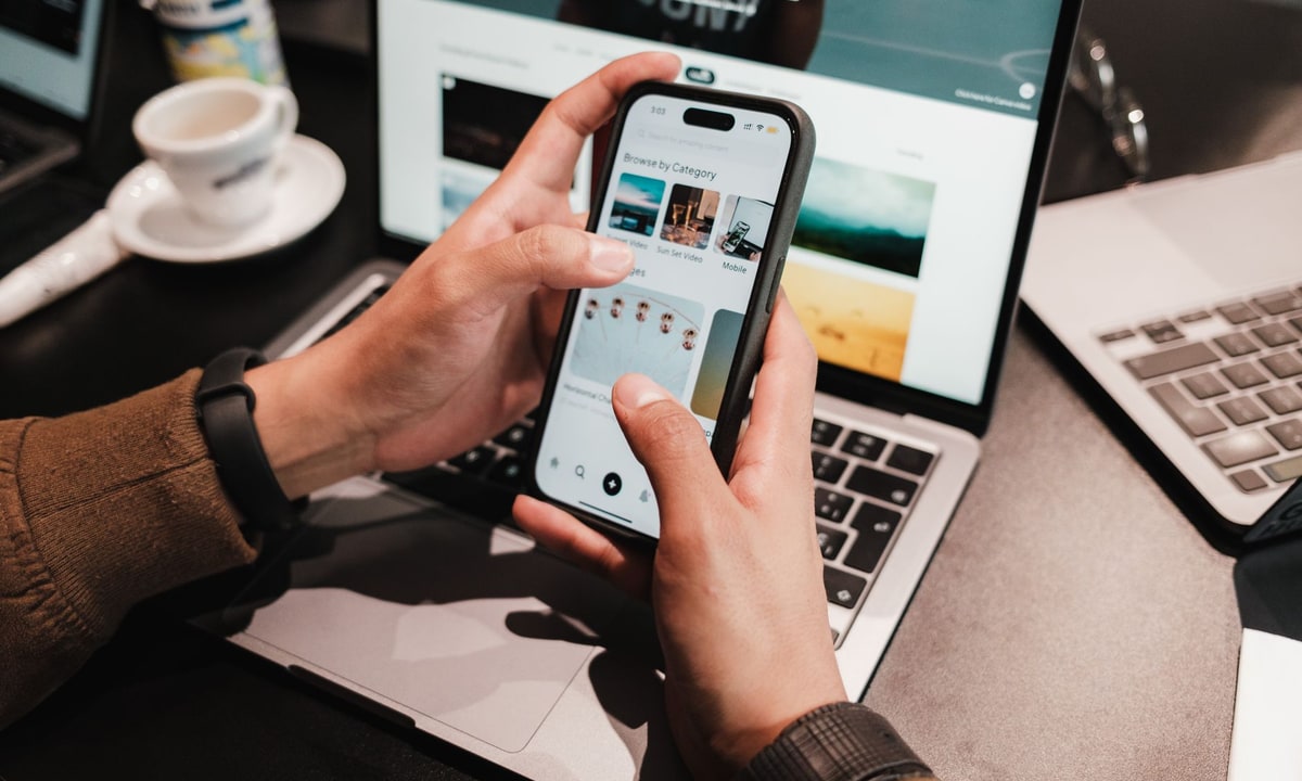 Small business owner using a smartphone chatbot