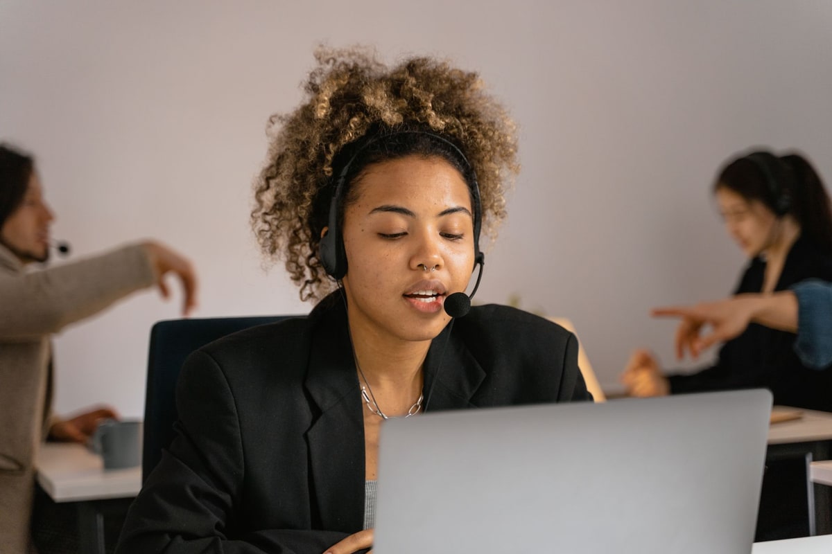 Support specialist reviewing an escalated customer conversation