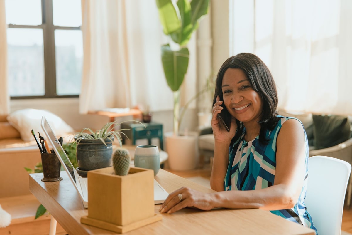 Business owner answering a customer call at a desk