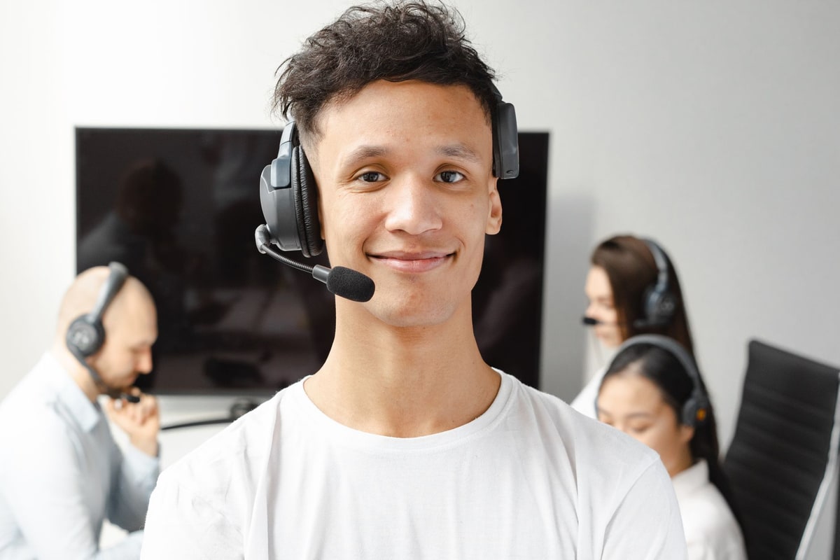Customer service representative wearing a headset and smiling