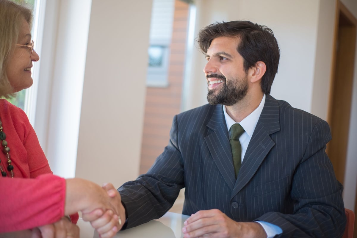 Advisor reviewing client onboarding steps during a meeting