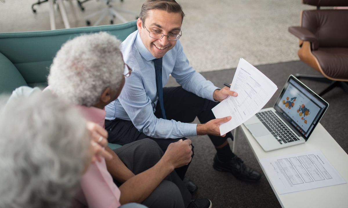 Financial advisor reviewing client intake information with a colleague