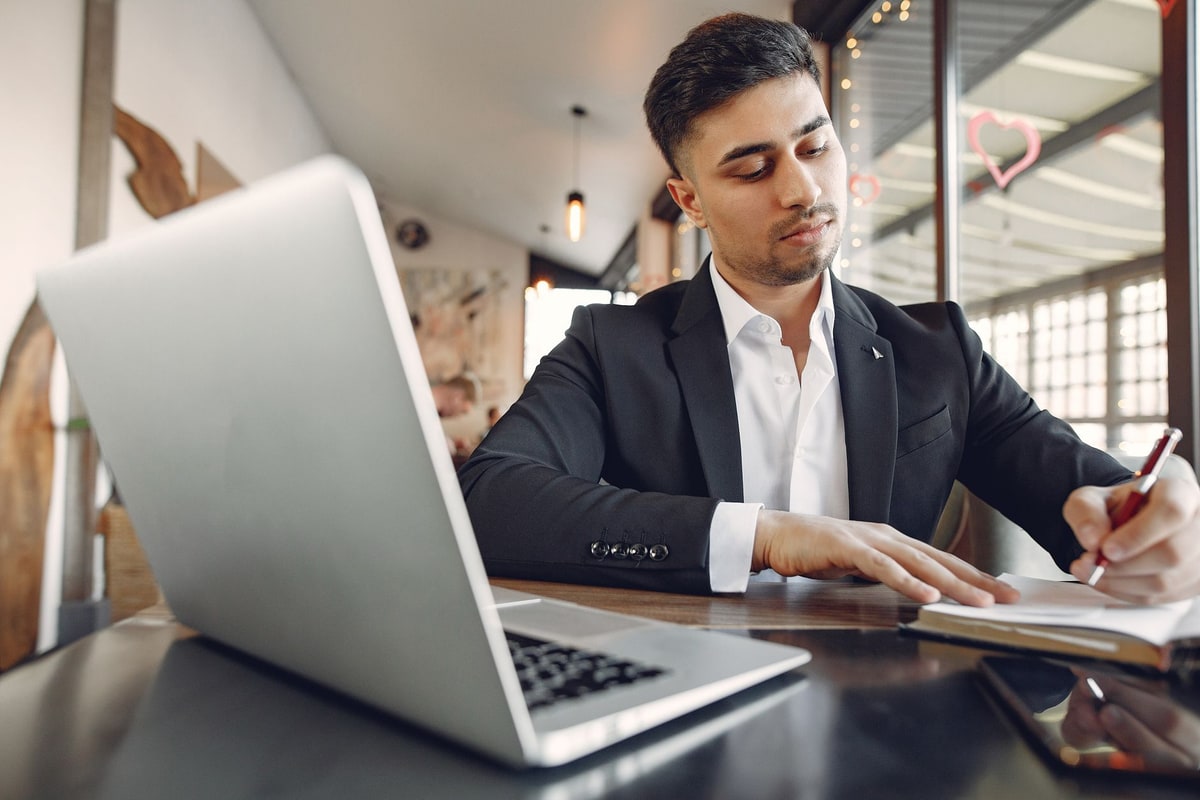 Business owner checking payment records and notes