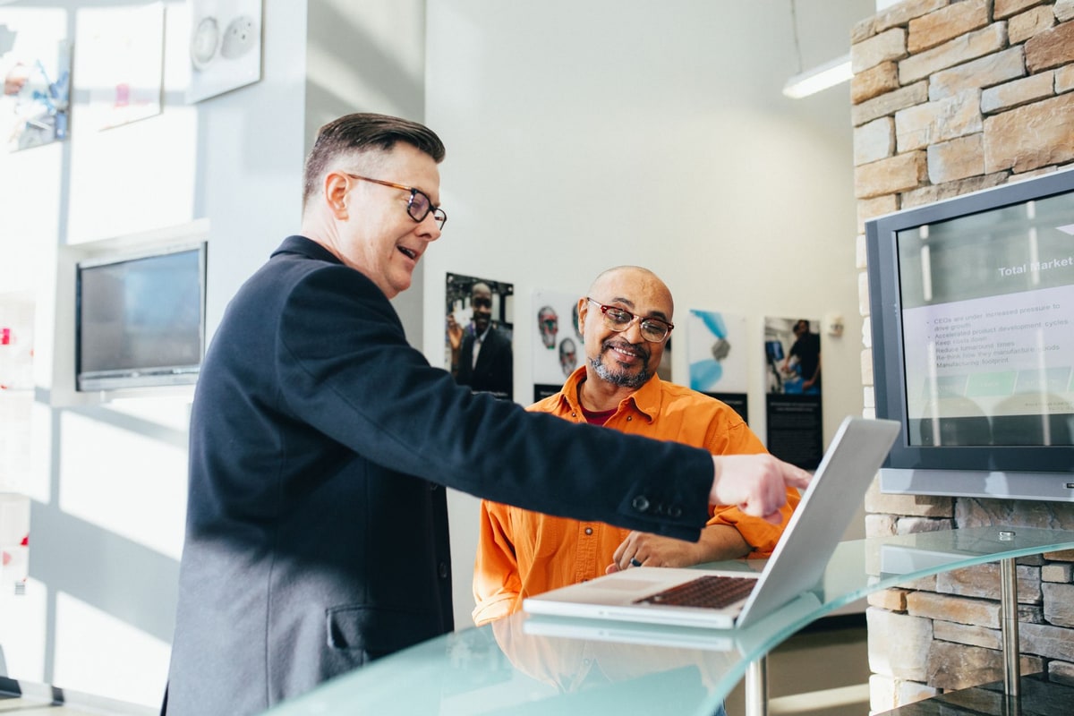 Sales representative reviewing CRM lead scores on a laptop