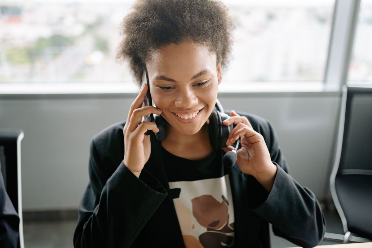 Field technician checking a customer message between service calls