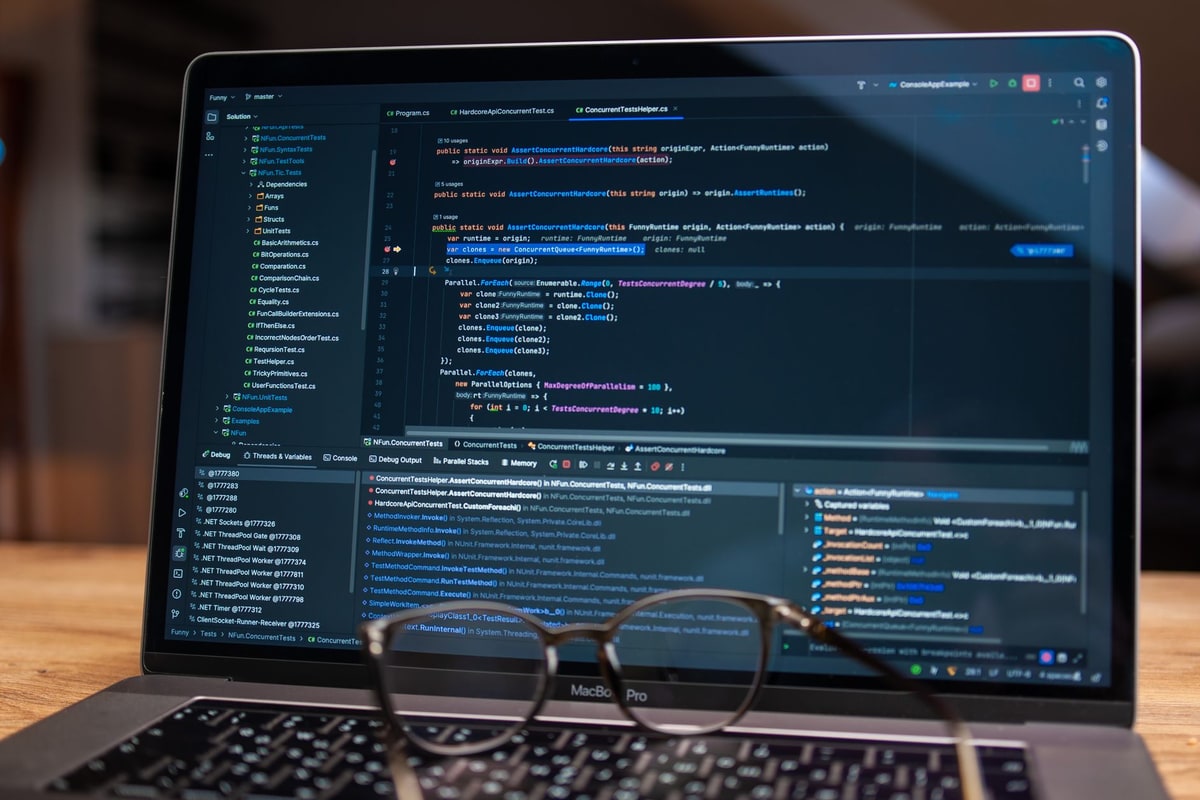 Business team reviewing software records and workflow ownership on a laptop