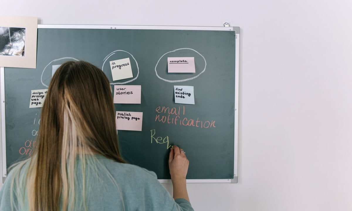 Business owner reviewing workflow notes before choosing an automation project