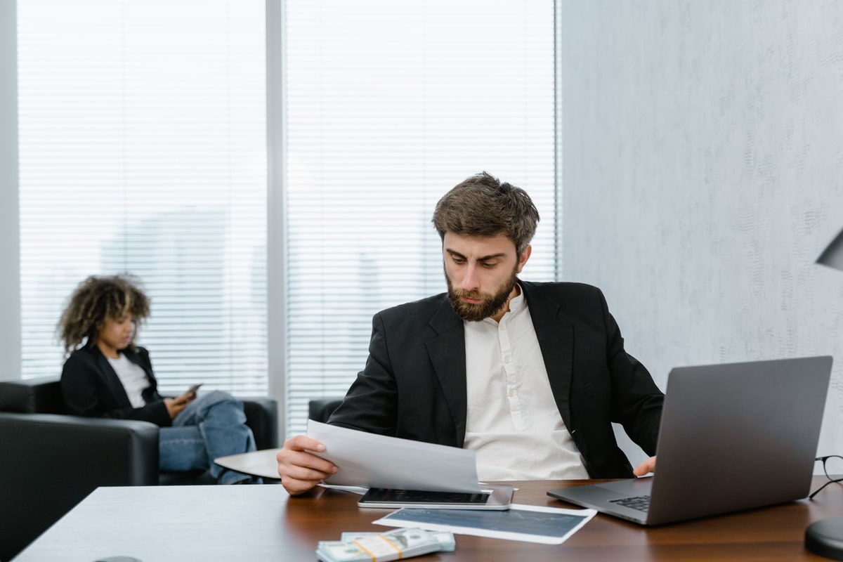 Business owner reviewing automation performance reports on a laptop