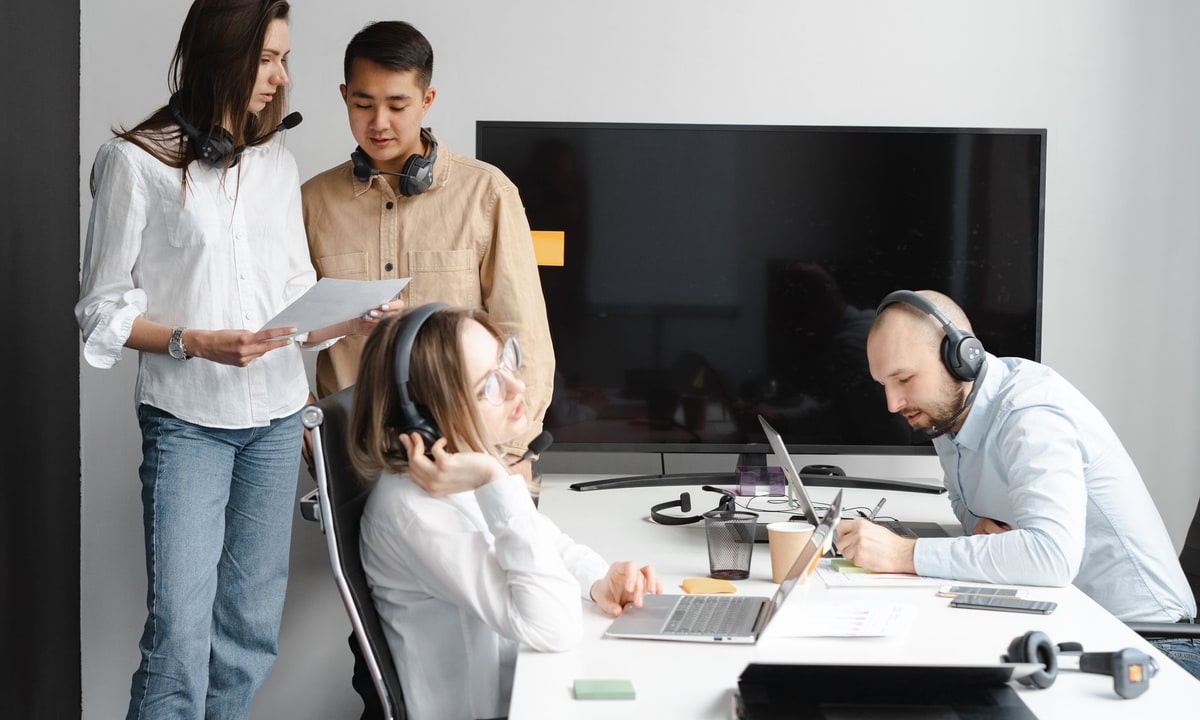 Sales team reviewing B2B outreach operations in an office