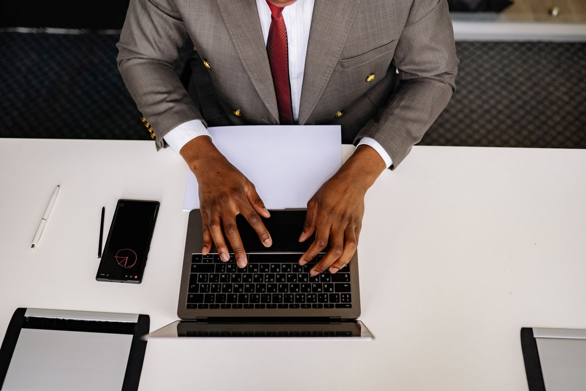 Sales manager reviewing lead records on a laptop