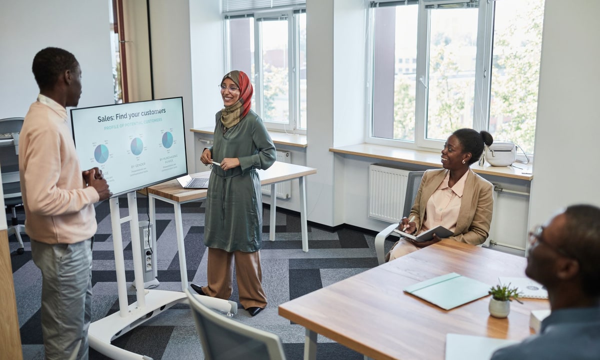 Sales team reviewing CRM priorities together in an office