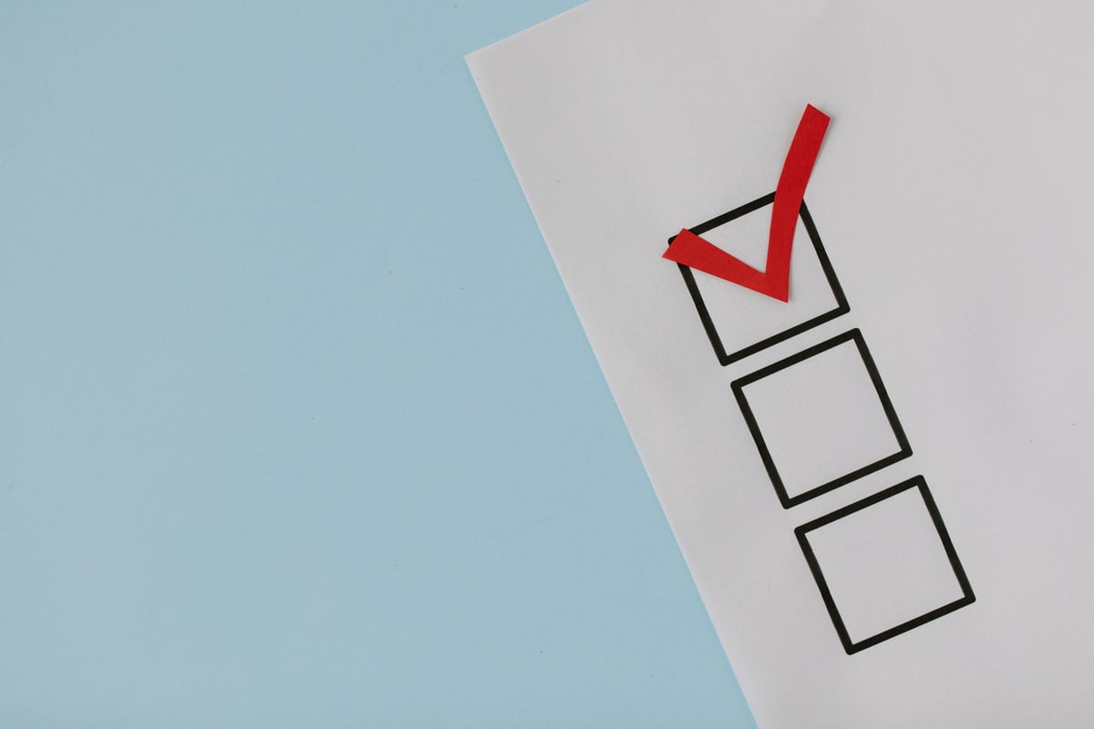 Checklist on a desk used to score a software decision
