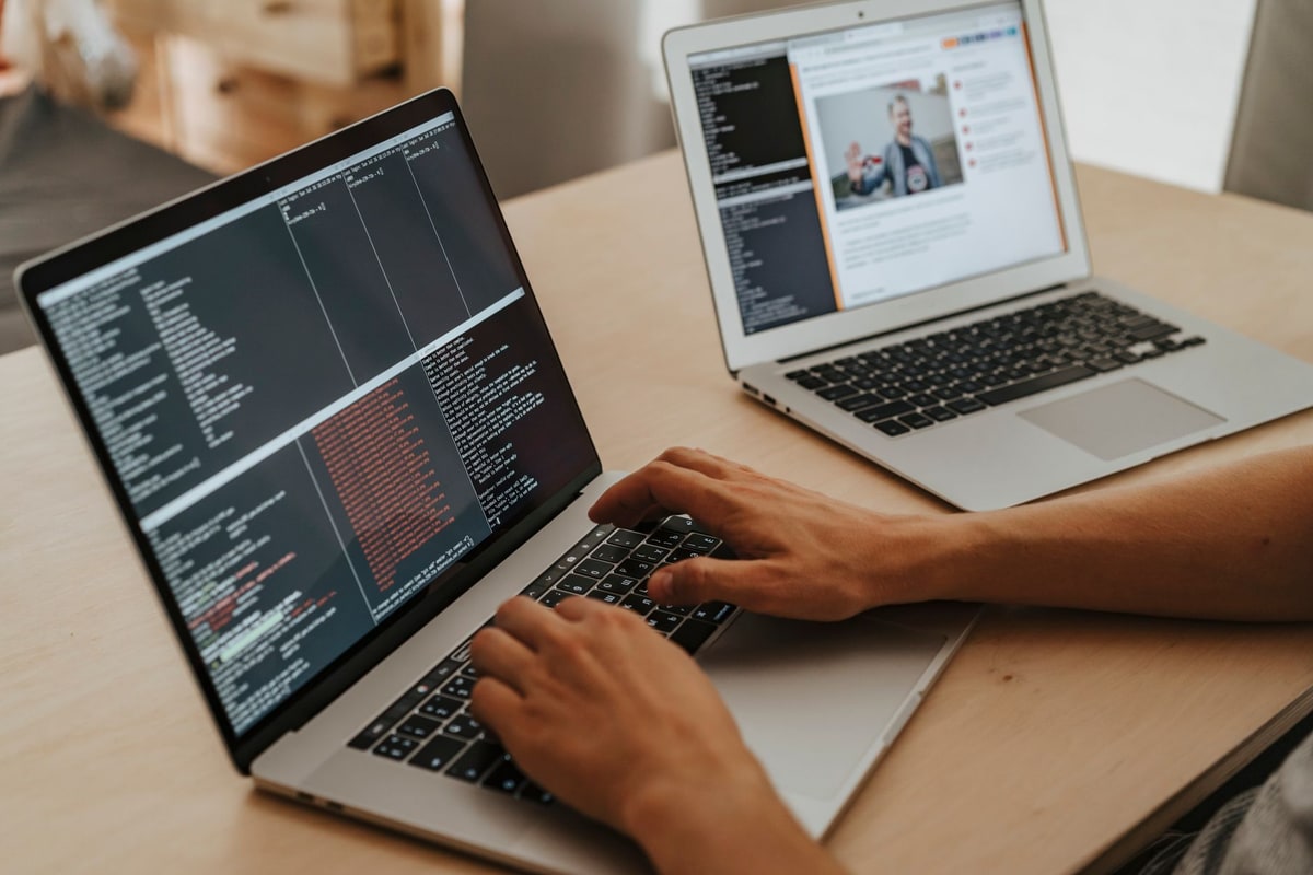 Developer testing custom automation code on a laptop