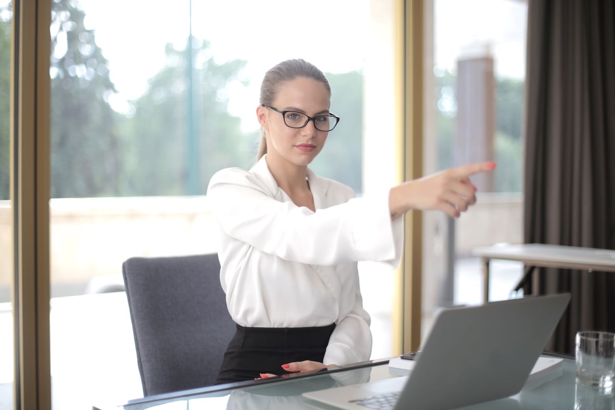 Operations manager reviewing automation ownership on a laptop