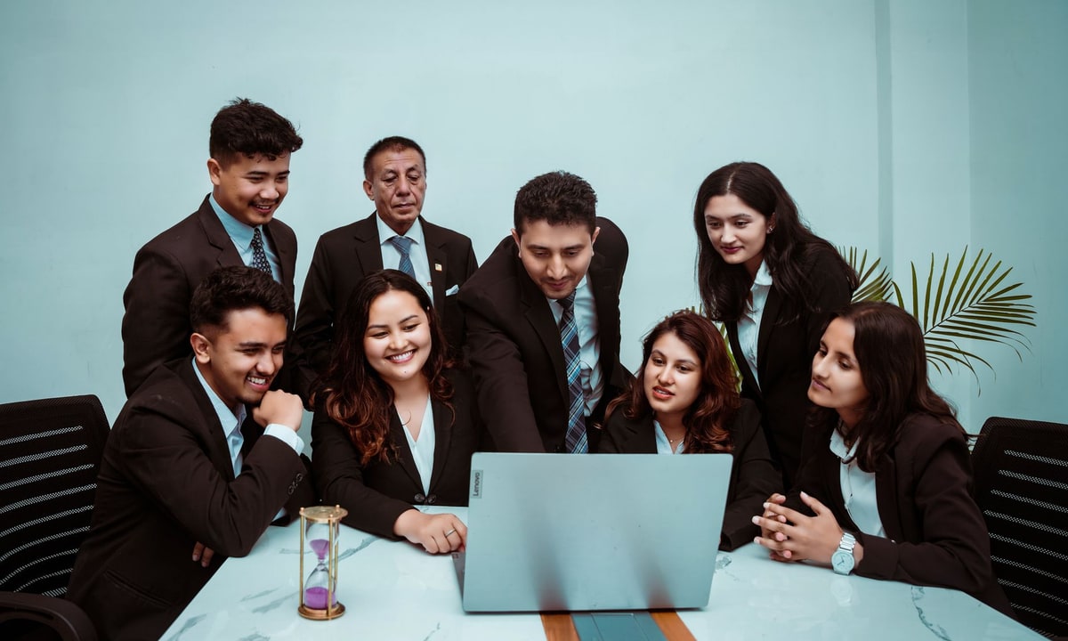 Small business team comparing build, buy, and hybrid automation options