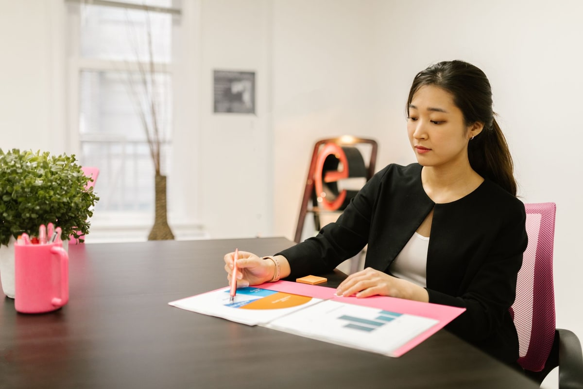 Business owner reviewing lead and appointment reports on a laptop