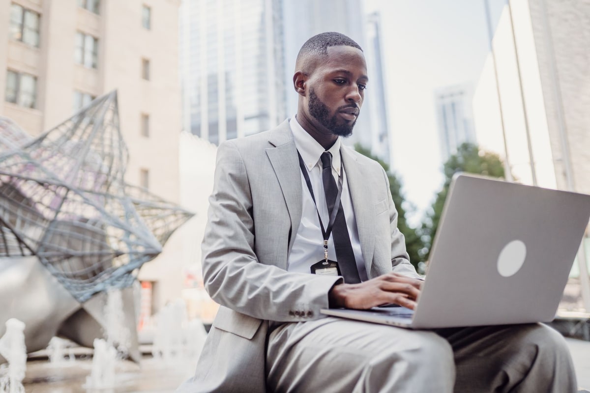 Business owner reviewing CRM access and account permissions on a laptop