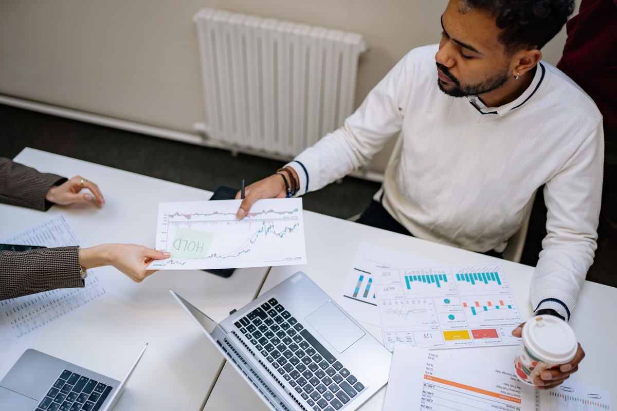 Business team auditing CRM records and data entry sources