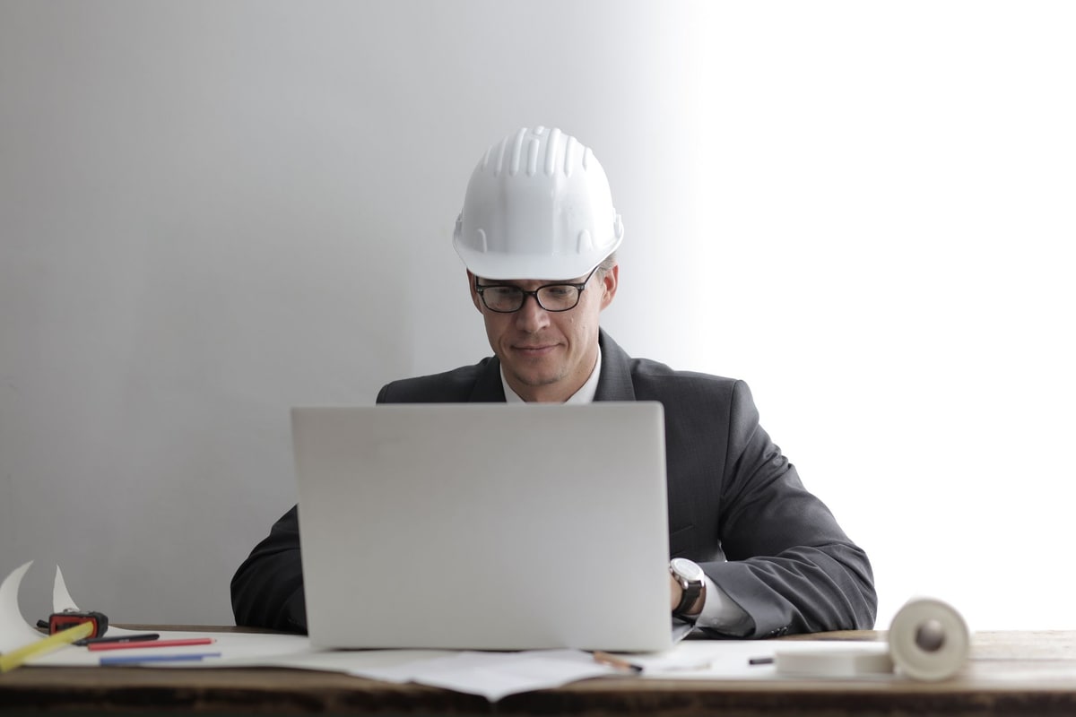 Manager reviewing lead assignment and follow-up results on a laptop