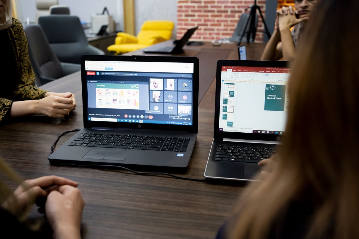 Operations manager reviewing business metrics on a laptop