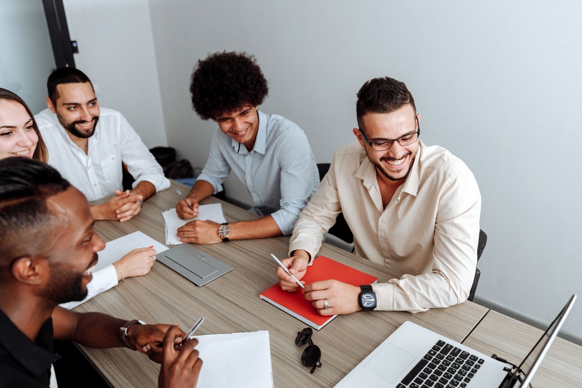 Team reviewing workflow responsibilities during an operations meeting