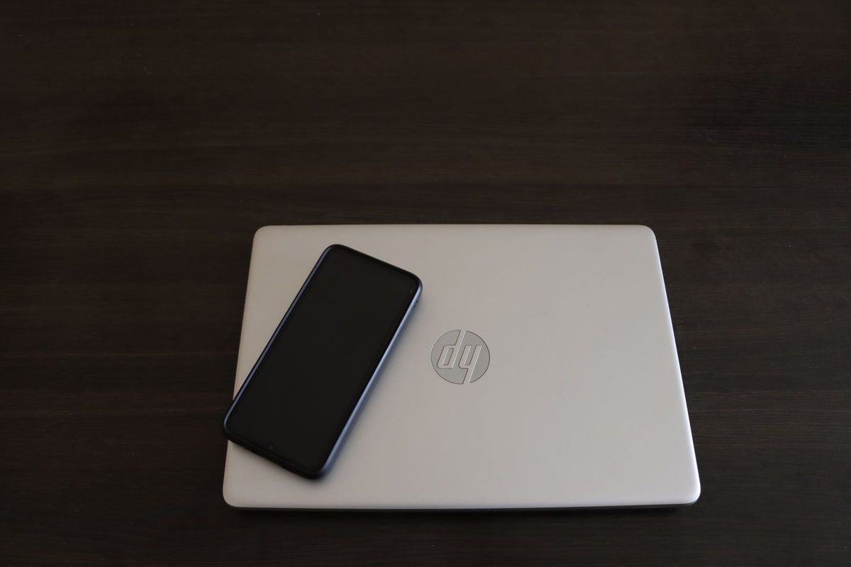 Team testing employee onboarding automation steps on a laptop