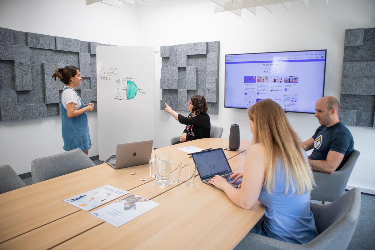 Business team reviewing reporting metrics during a meeting