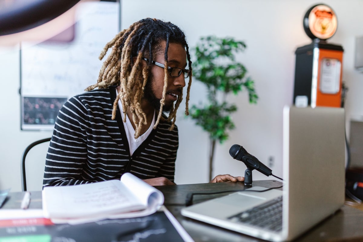 Business manager reviewing imported CRM records on a laptop