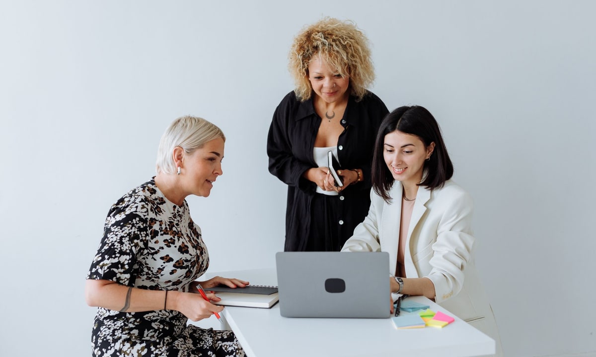 Small business team planning a CRM automation setup around a conference table