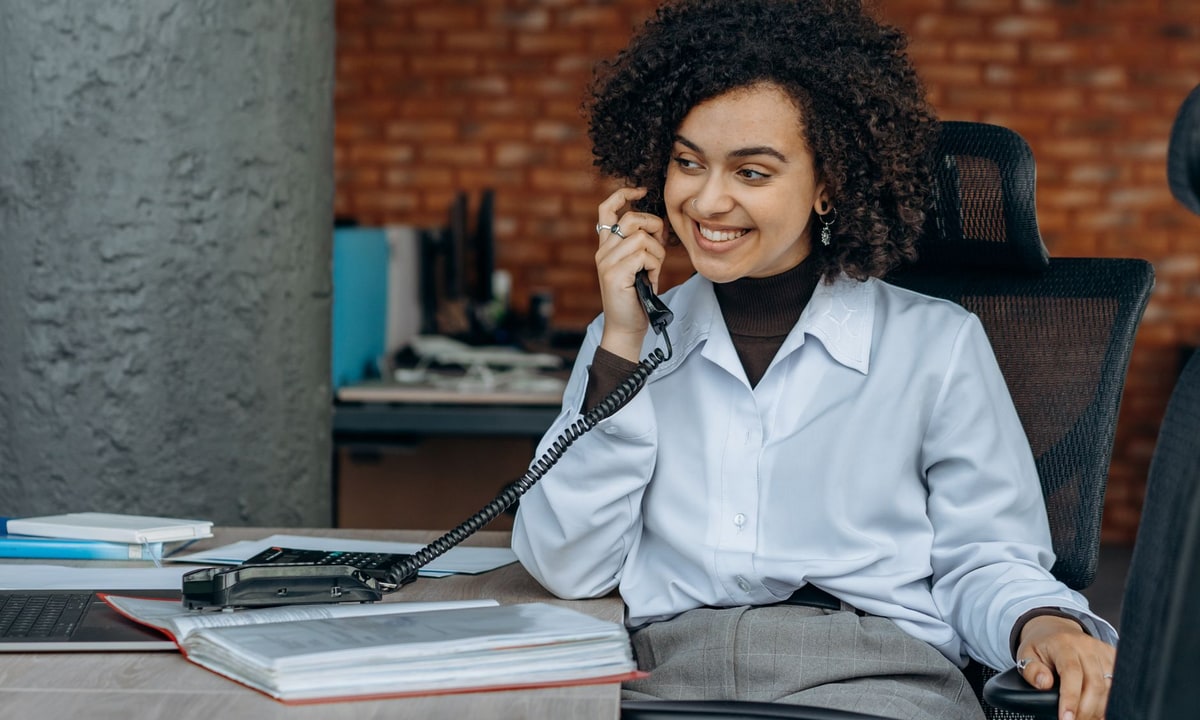 Small business owner looking at missed call notifications on a phone