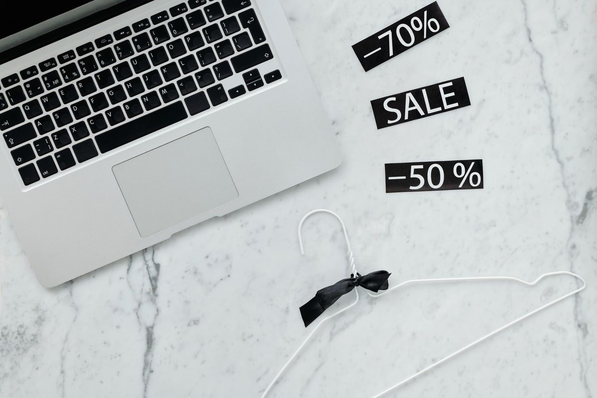 Sales manager reviewing reporting metrics on a laptop