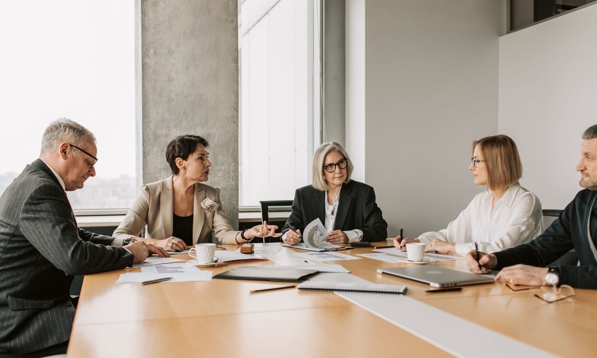 Business team reviewing CRM reporting on a shared screen