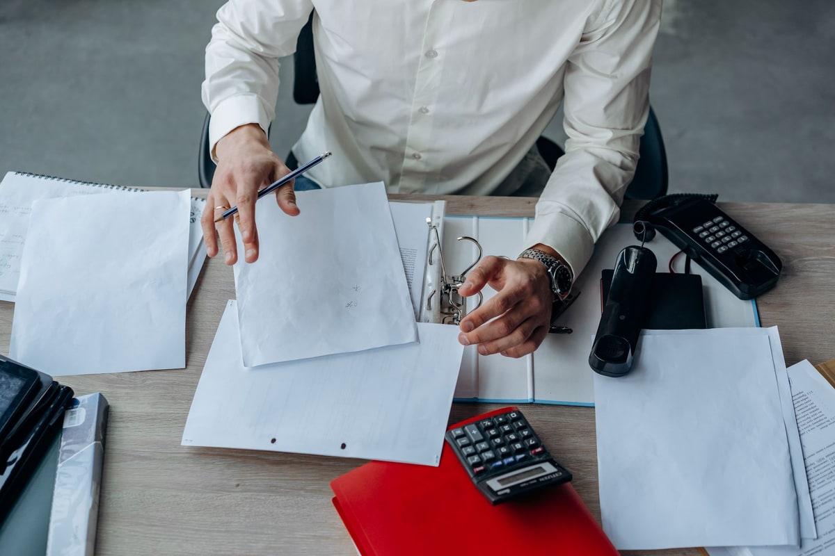 Business manager reviewing implementation documents in an office