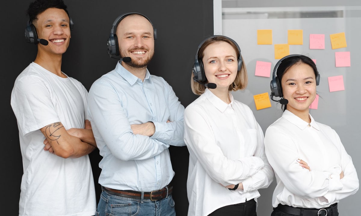 Sales team reviewing lead records together on a laptop