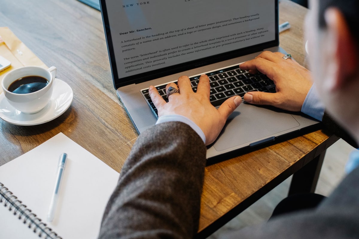 Manager reviewing lead assignment details on a laptop