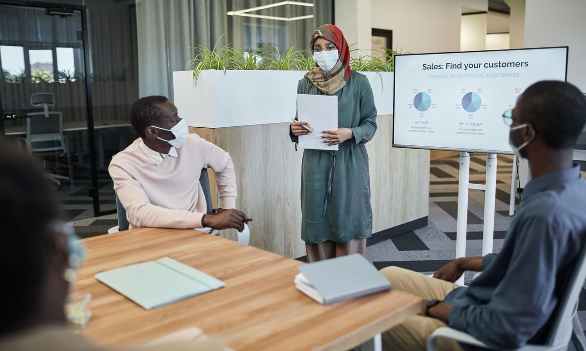 Sales team comparing lead management software during a meeting