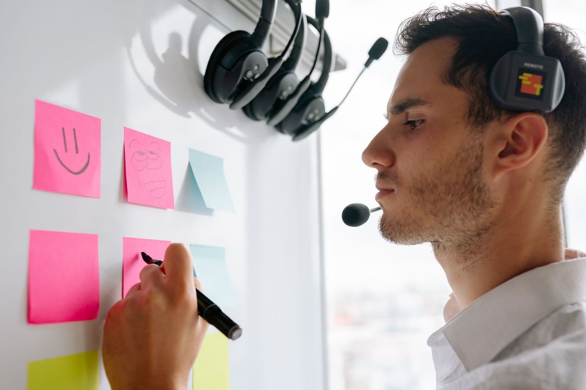 Team member writing a short recap message after a call