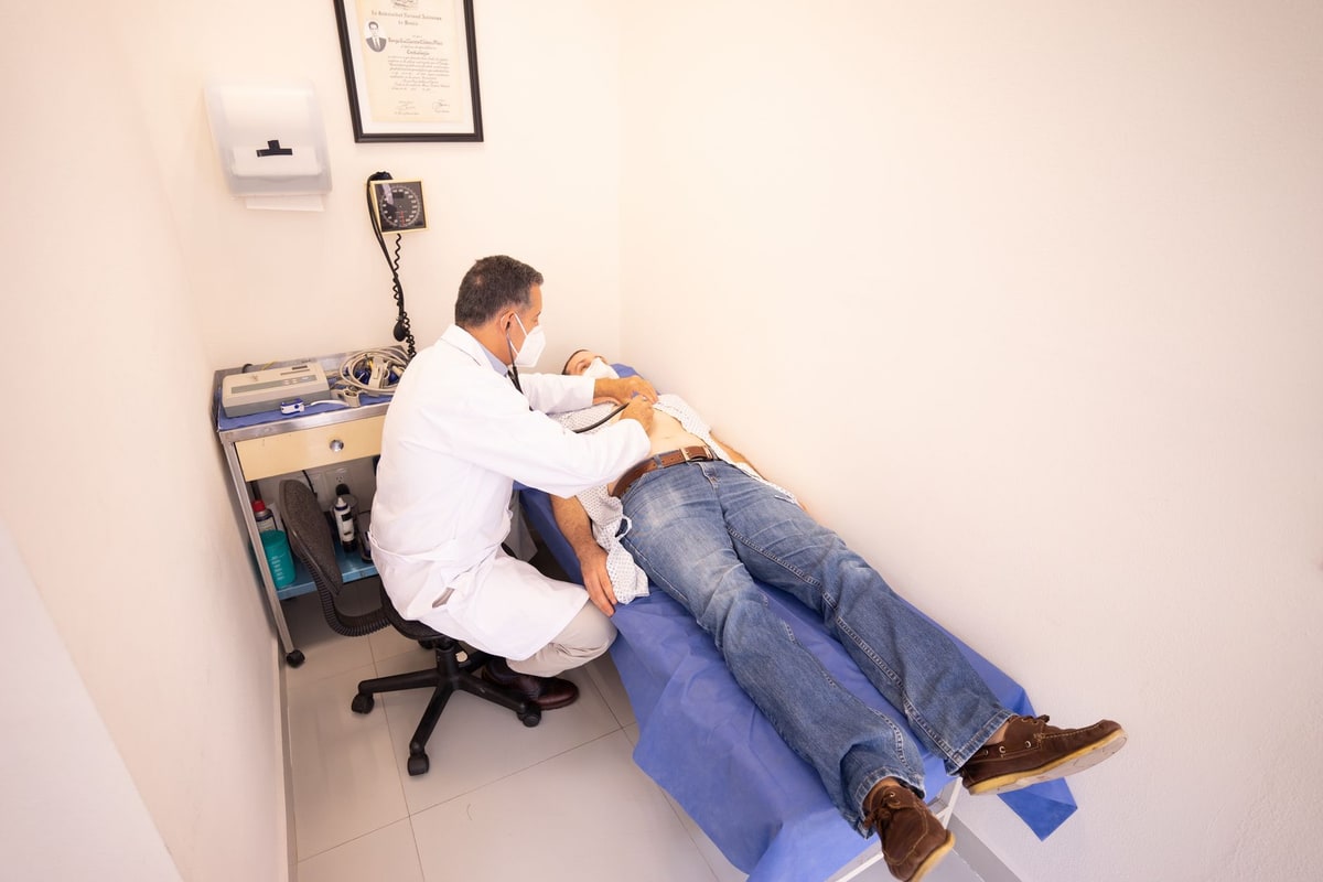 Clinic appointment calendar being reviewed at a front desk