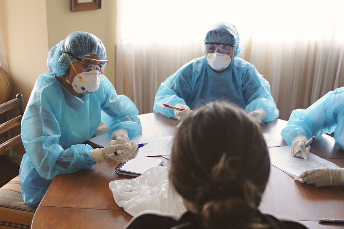 Healthcare office team reviewing a booking workflow together