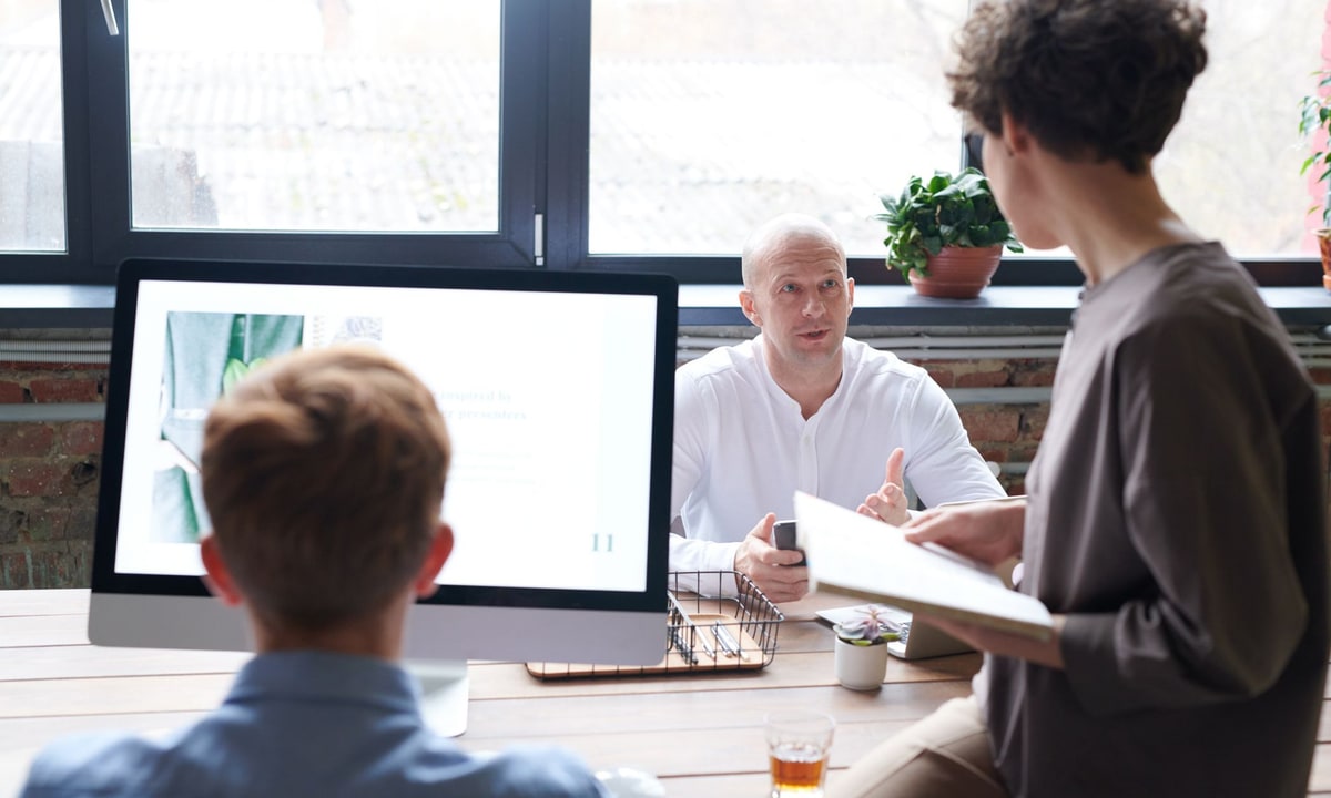 Business owner reviewing two automation service proposals
