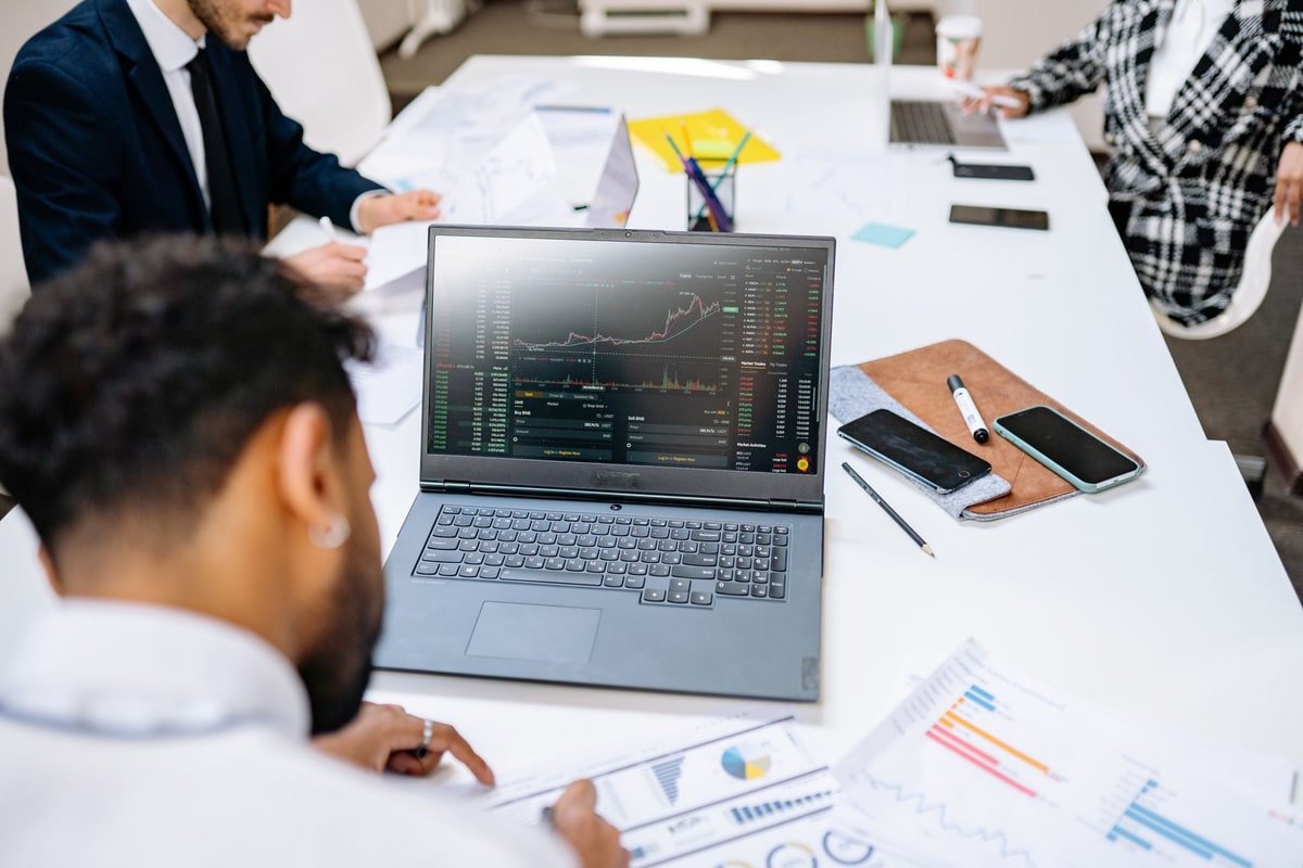 Business team testing an automation workflow on a laptop