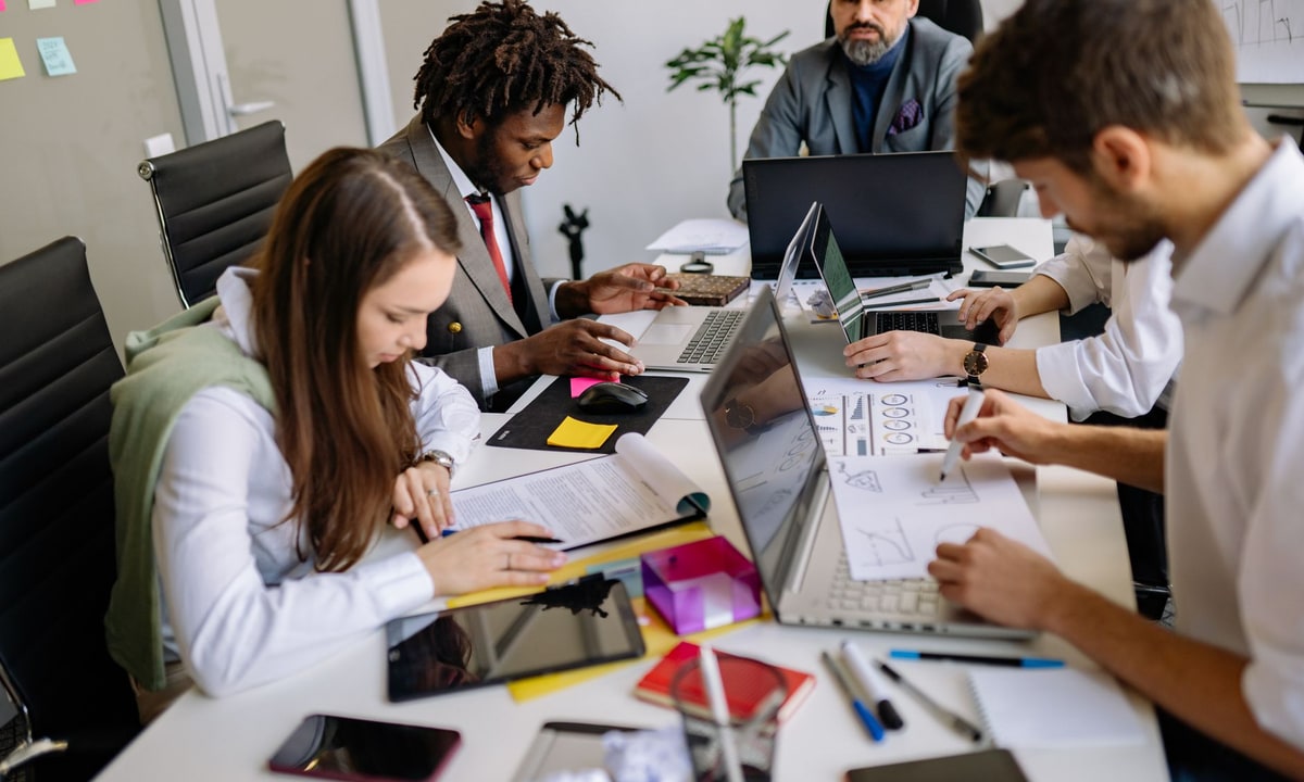 Small business marketing team reviewing a social media content workflow