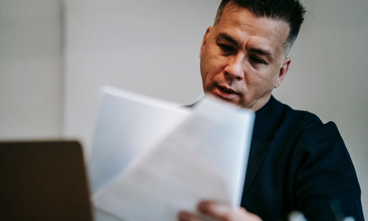 Service business owner comparing manual and automated quoting