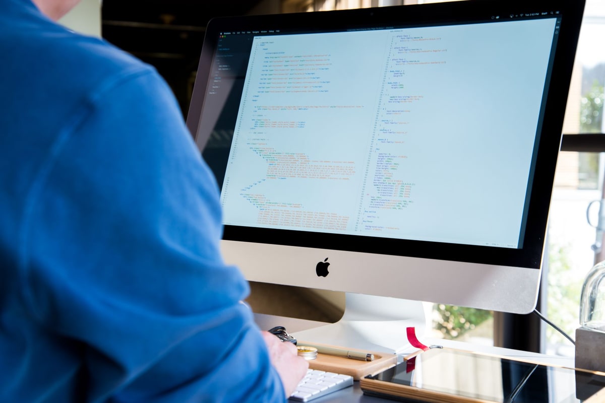 Software developer working on custom backend automation code