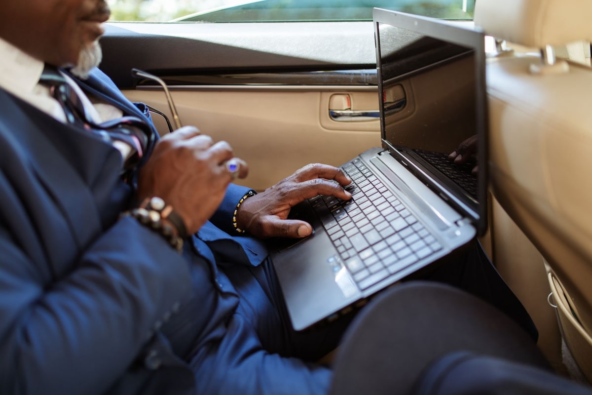 Operations team reviewing workflow steps on a laptop
