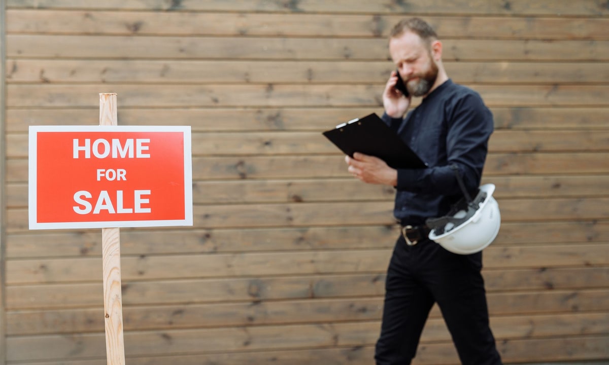 Property manager reviewing leasing workflow information on a laptop