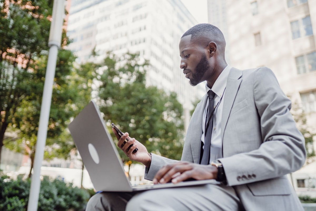 Salesperson preparing proposal details on a laptop