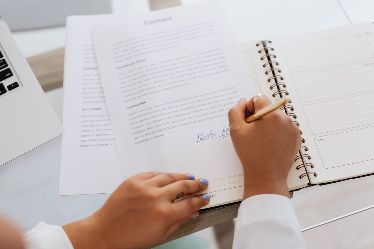 Client signing a business proposal document