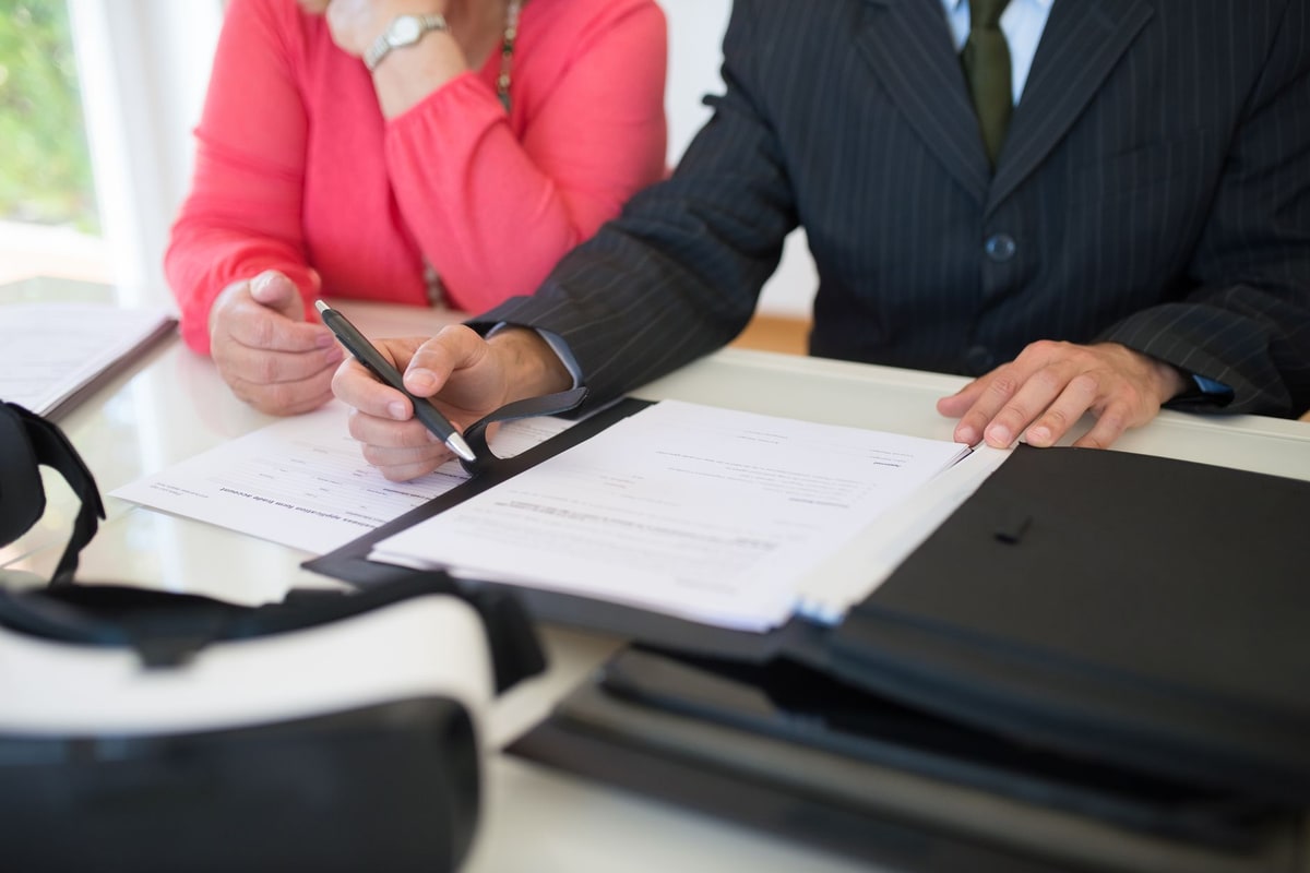 Agency team reviewing a contract before client signature